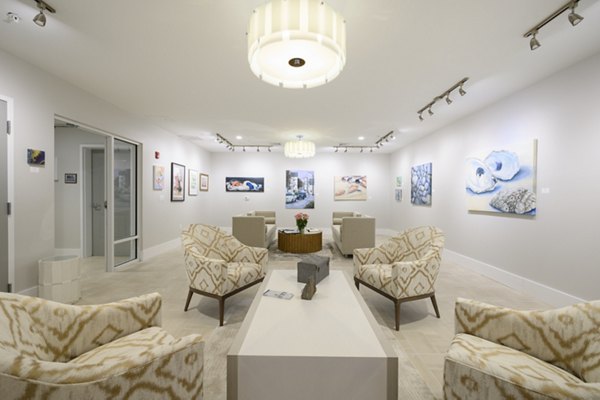 Elegant clubhouse with stylish seating and fireplace at Everleigh Cape Cod luxury apartments