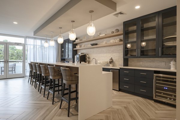 Clubhouse with elegant lounge seating and fireplace at Everleigh Cape Cod luxury apartments