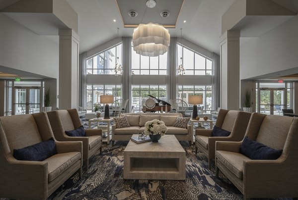 Clubhouse with stylish dÃ©cor and cozy seating at Everleigh Cape Cod, a luxurious Greystar active adult community offering modern living on Cape Cod