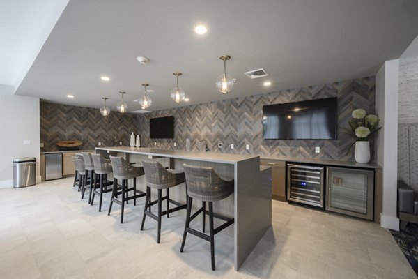 Modern clubhouse featuring cozy seating and billiards at Everleigh Cape Cod luxury apartments