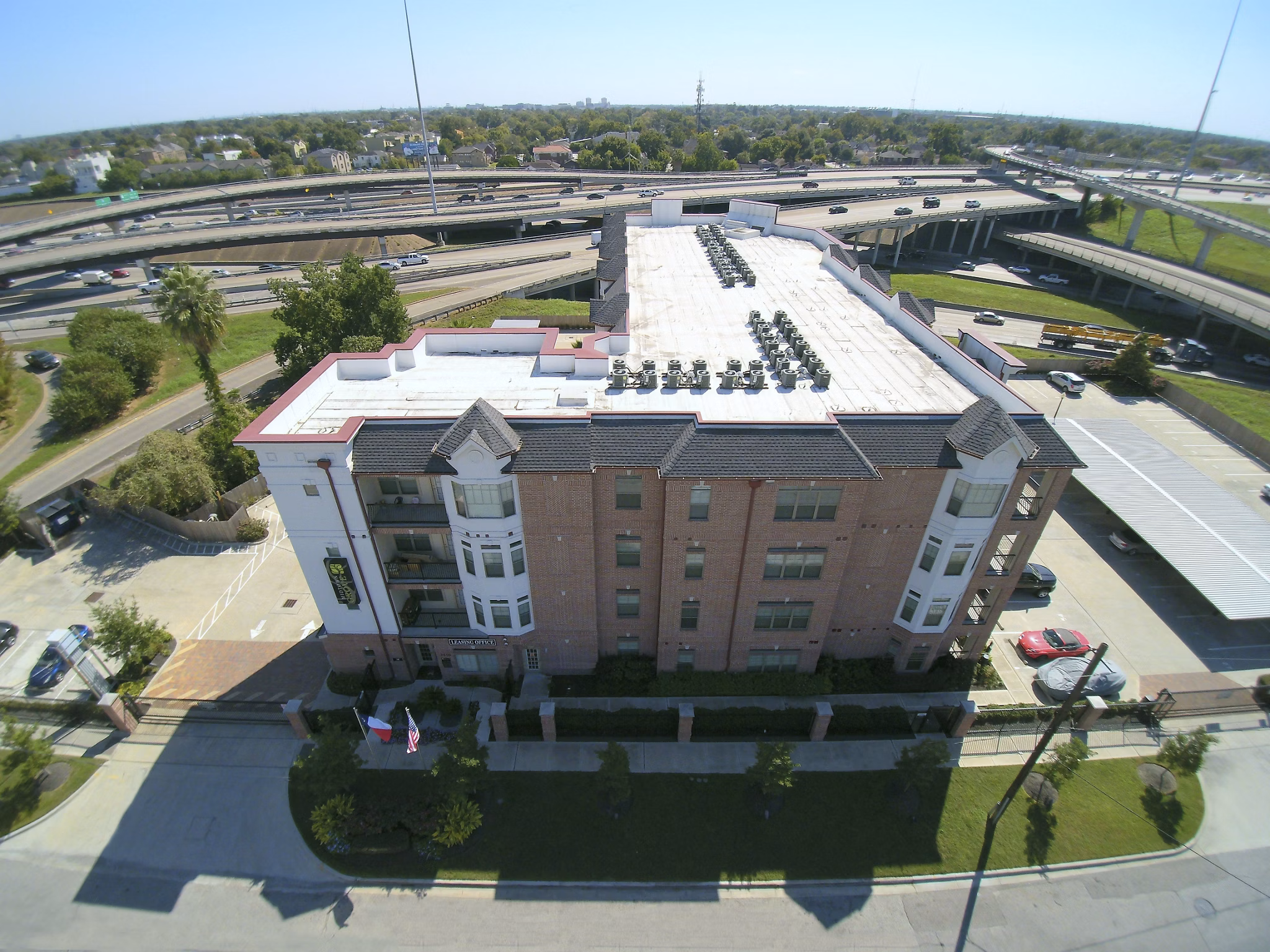 Modern luxury apartments near a highway interchange in a vibrant urban area