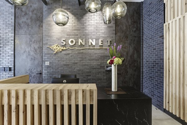 Elegant clubhouse with modern design at Sonnet Apartments, perfect for social gatherings and relaxation