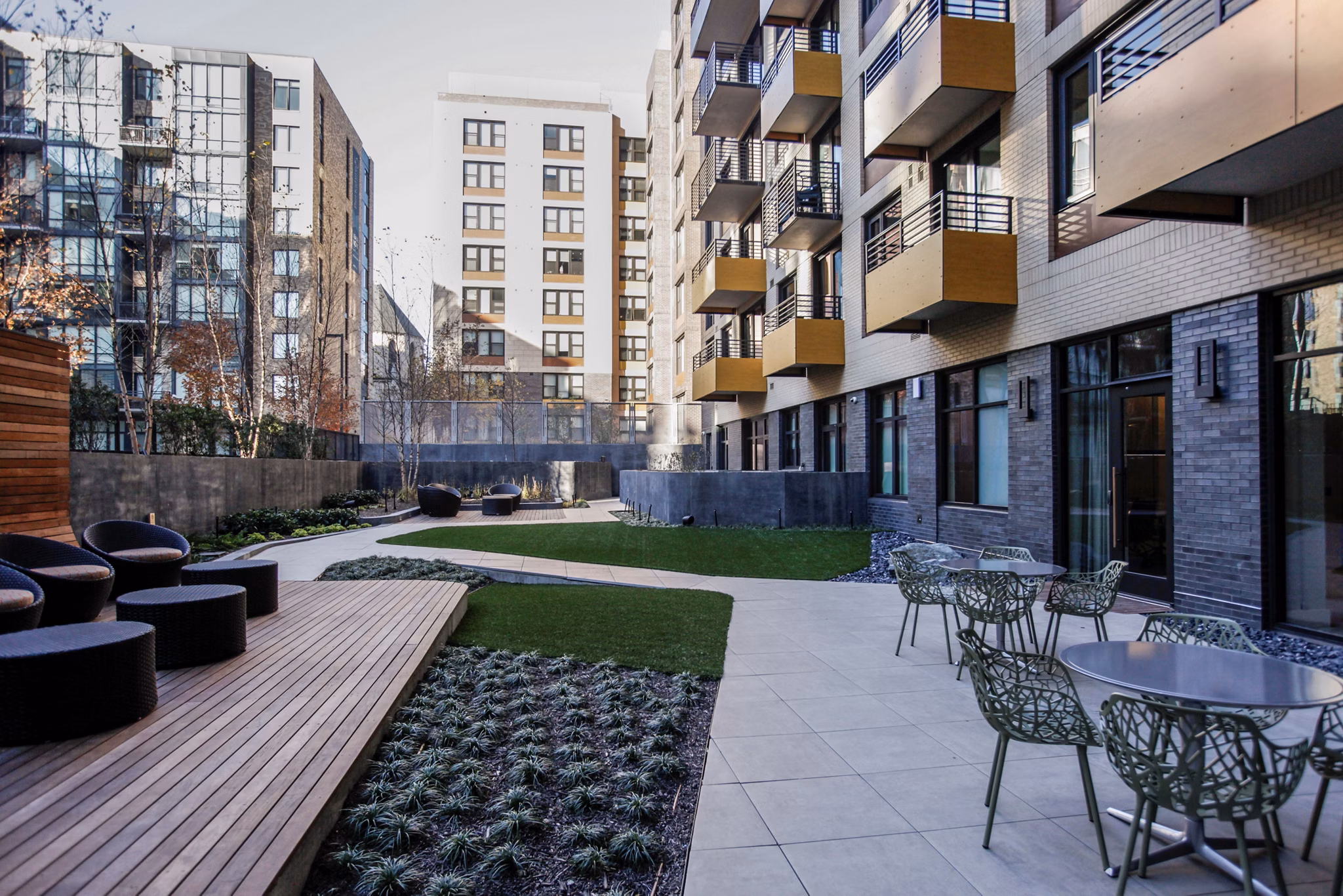 Sonnet Apartments: Tranquil courtyard with lush greenery and seating areas