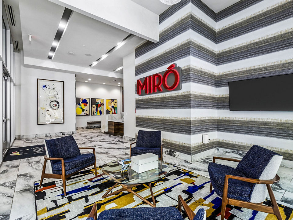 Clubhouse lobby with modern furnishings at Miro Apartments, a luxury Greystar property