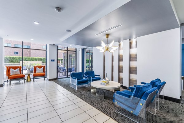 Modern clubhouse lobby with stylish seating and art at Miro Apartments