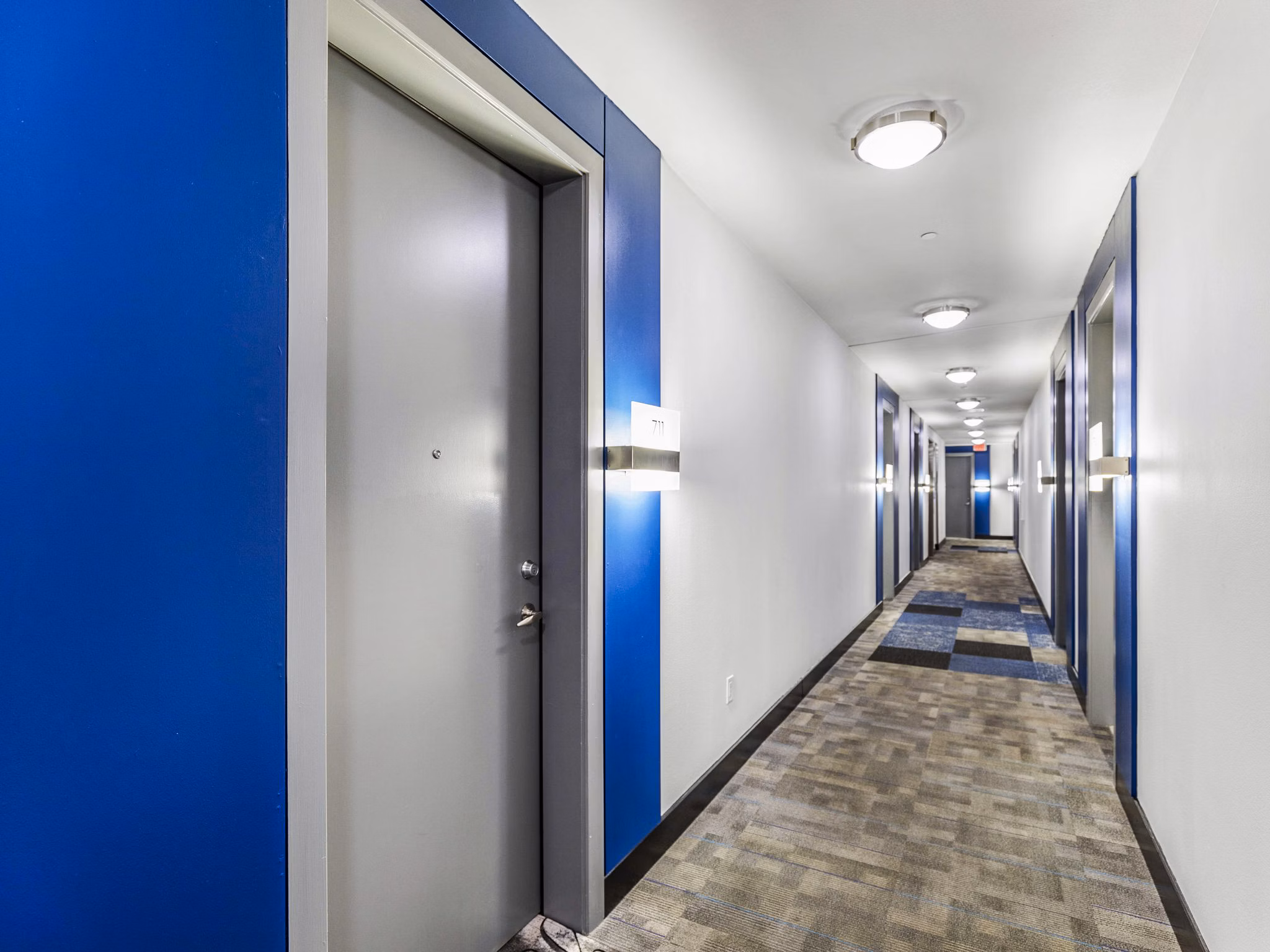 Modern hallway with sleek lighting at Miro Apartments, luxury living by Greystar in the heart of downtown