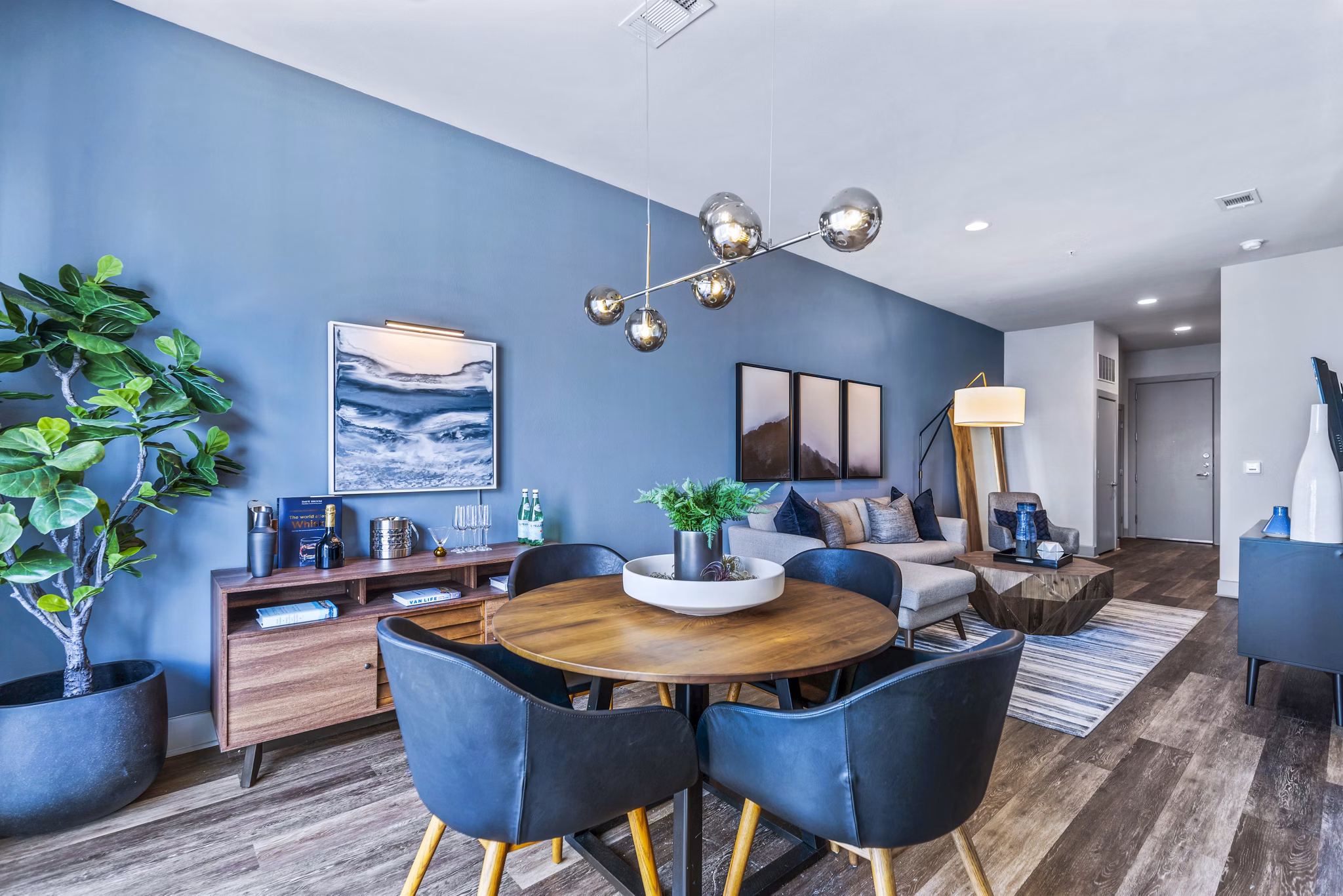 Dining room featuring modern decor and elegant lighting at Miro Apartments