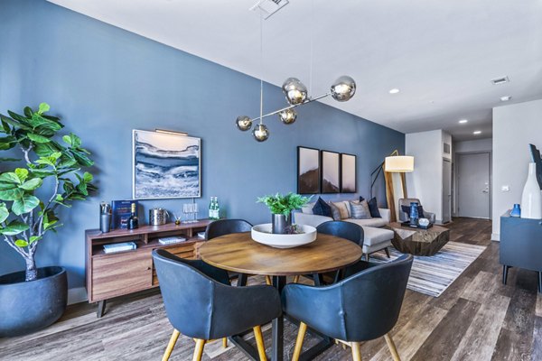 Dining room featuring modern decor and elegant lighting at Miro Apartments