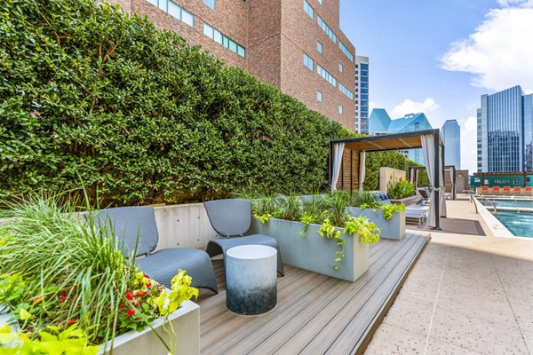 Luxury pool patio with stylish seating at Miro Apartments, offering relaxation in a premium residential setting