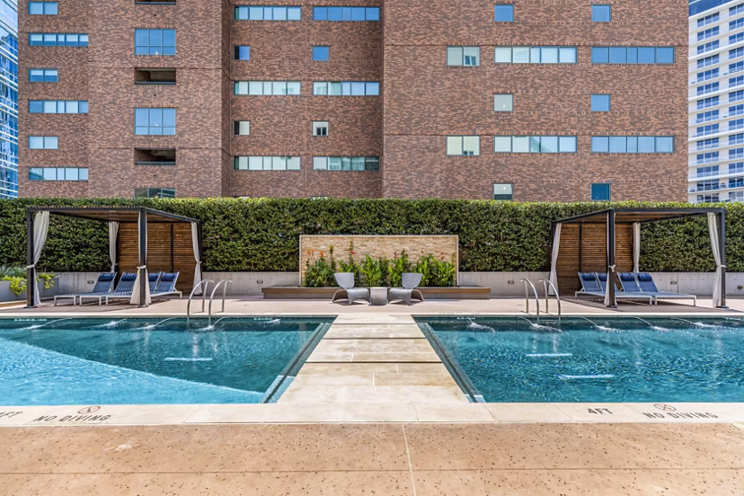 Luxurious outdoor pool area at Miro Apartments, perfect for relaxation and leisure in a serene setting