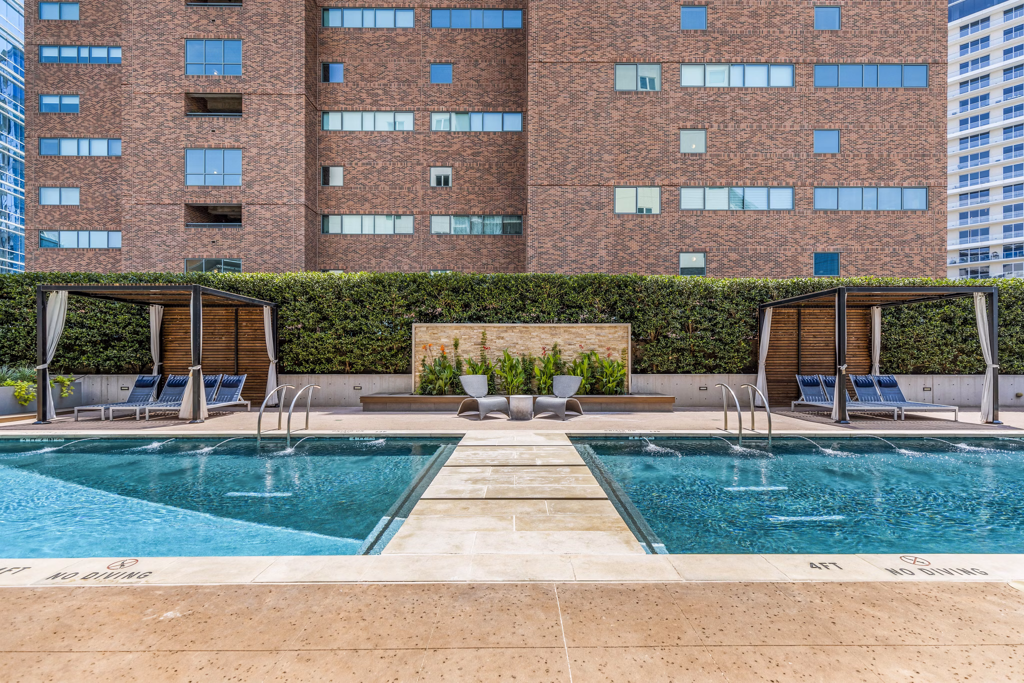 Luxurious outdoor pool area at Miro Apartments, perfect for relaxation and leisure in a serene setting