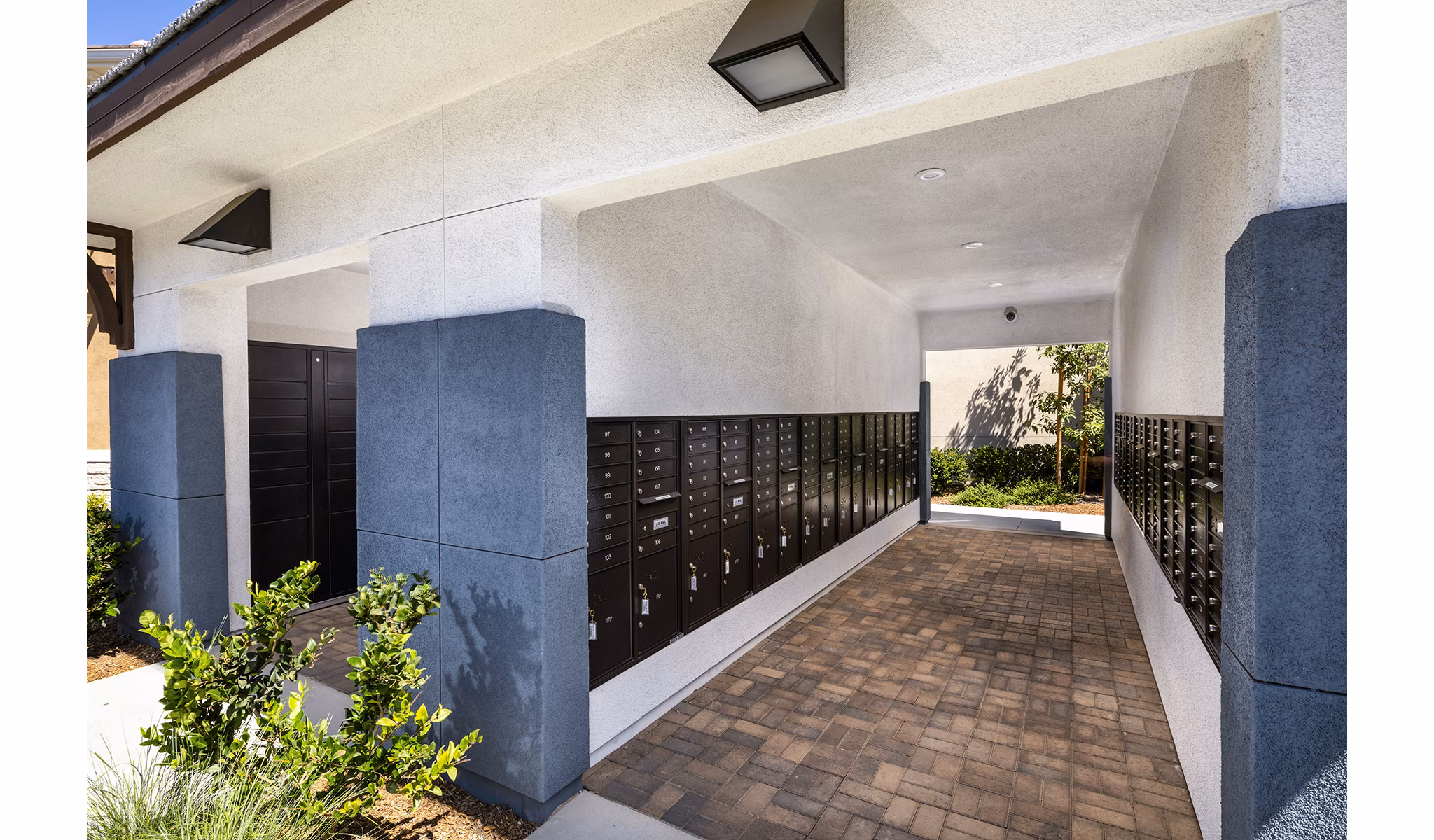 Modern mail room with secure parcel lockers at Core at Sycamore Highlands luxury apartments