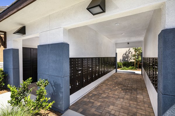 Modern mail room with secure parcel lockers at Core at Sycamore Highlands luxury apartments