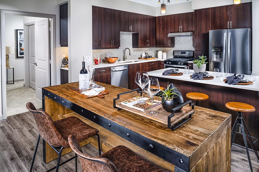 Dining room with modern decor and ample sunlight at Core at Sycamore Highlands apartments