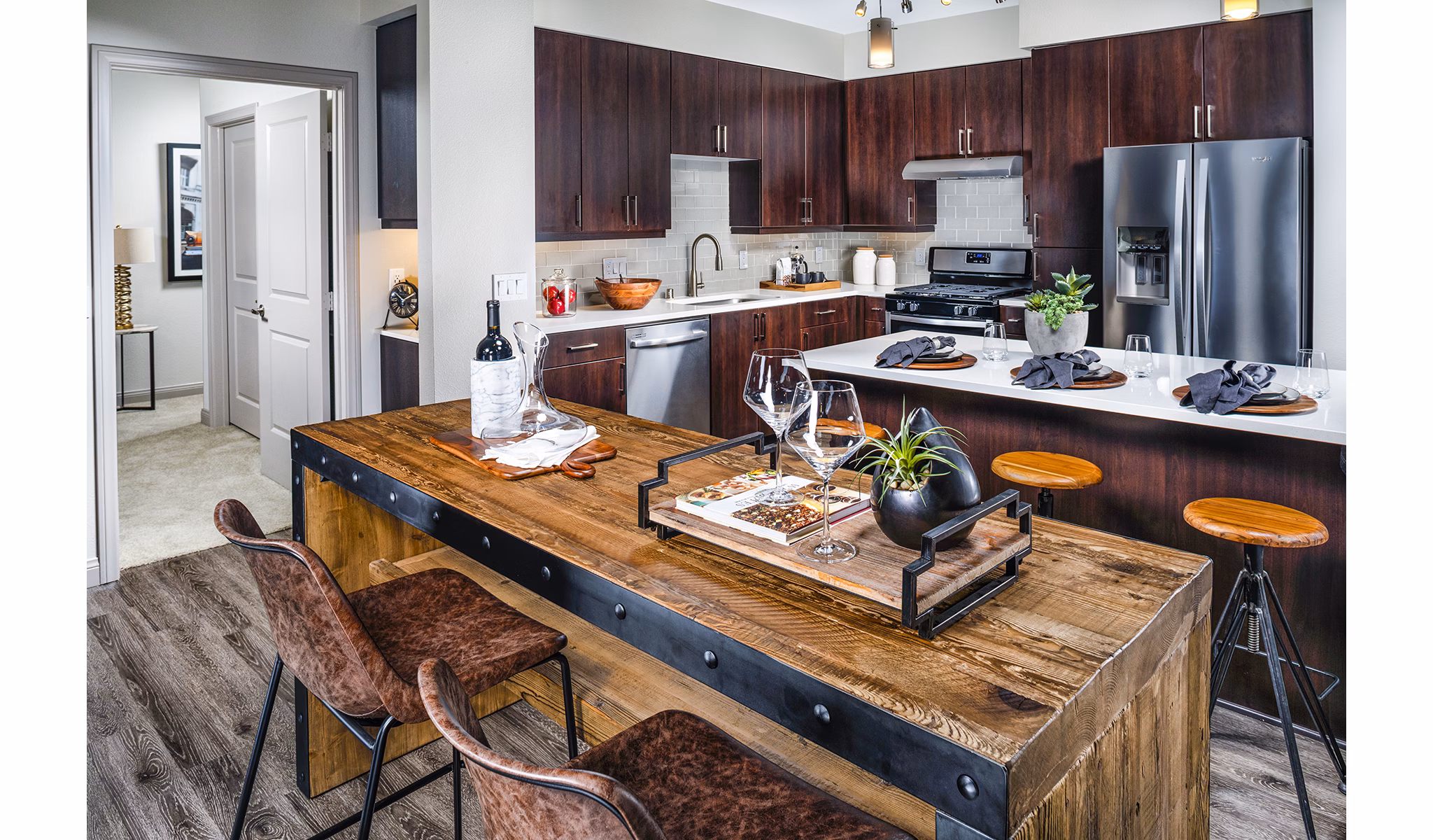Dining room with modern decor and ample sunlight at Core at Sycamore Highlands apartments