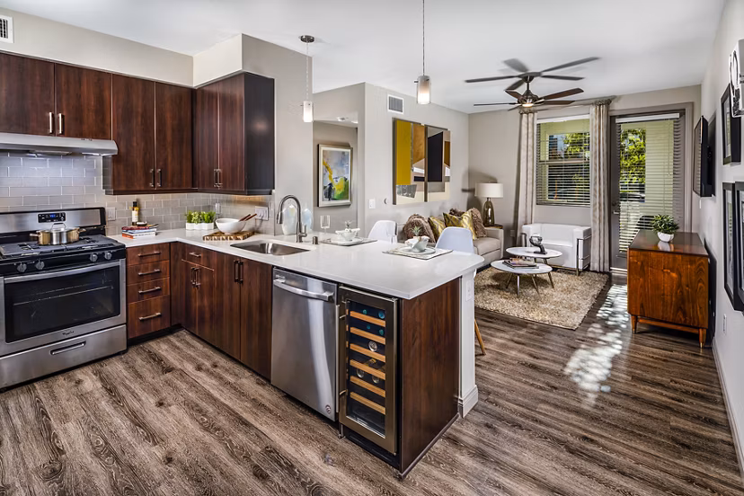 Modern kitchen featuring stainless steel appliances at Core at Sycamore Highlands luxury apartments