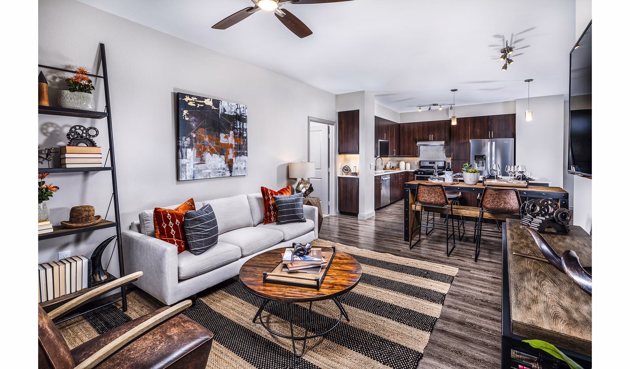 Spacious living room with modern decor and large windows at Core at Sycamore Highlands, luxury apartments