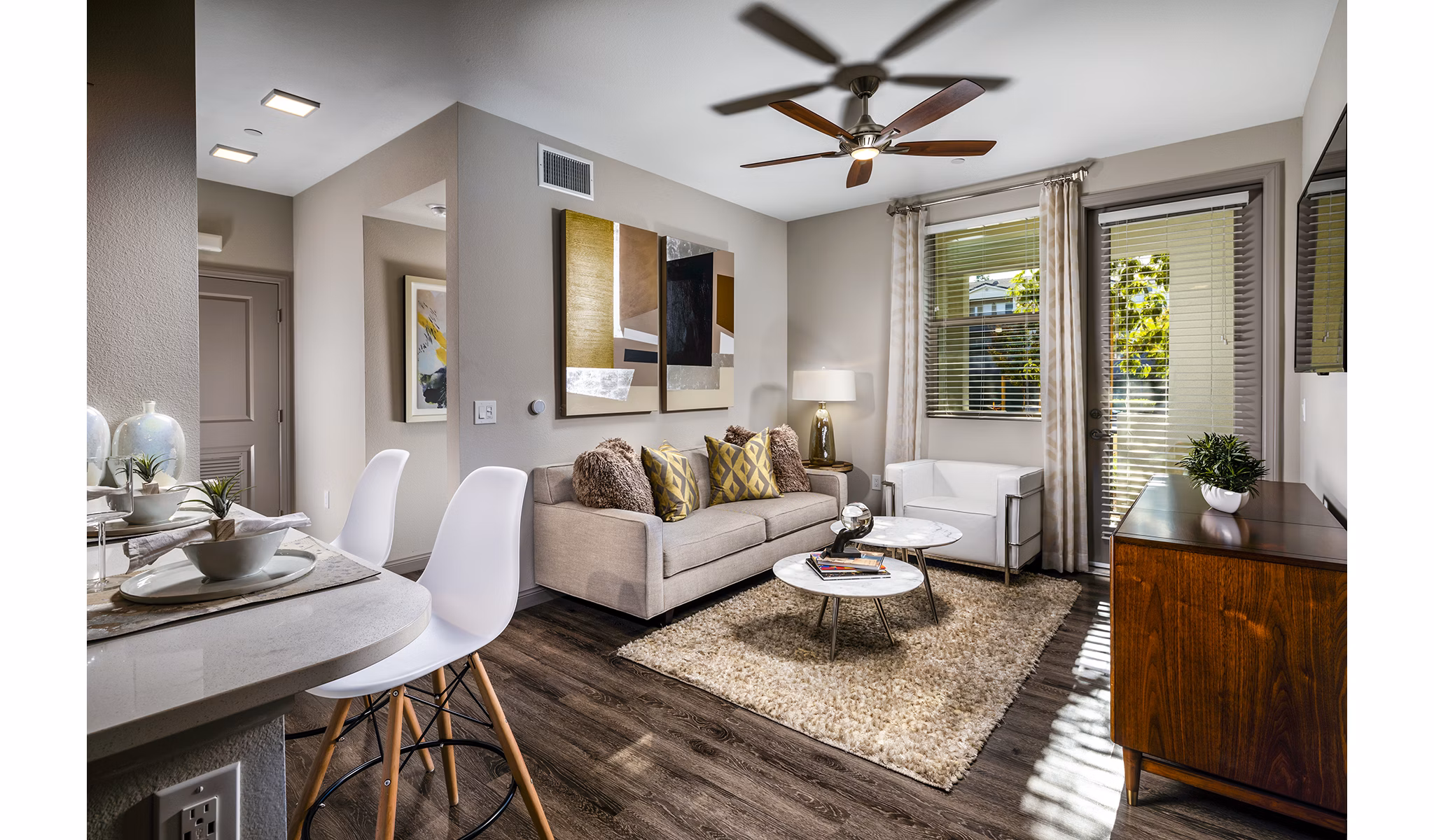 Modern living room with stylish furnishings at Core at Sycamore Highlands, featuring cozy seating and ample natural light
