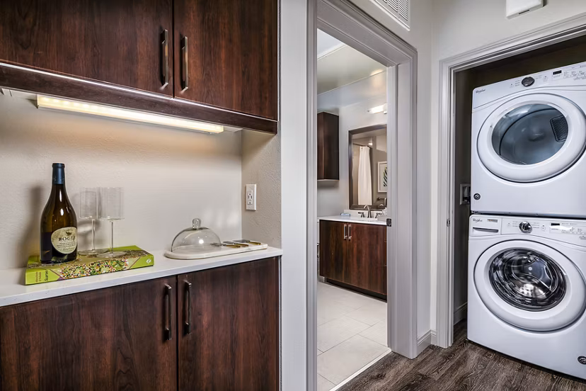 Modern laundry room with front-load washers and dryers at Core at Sycamore Highlands apartments