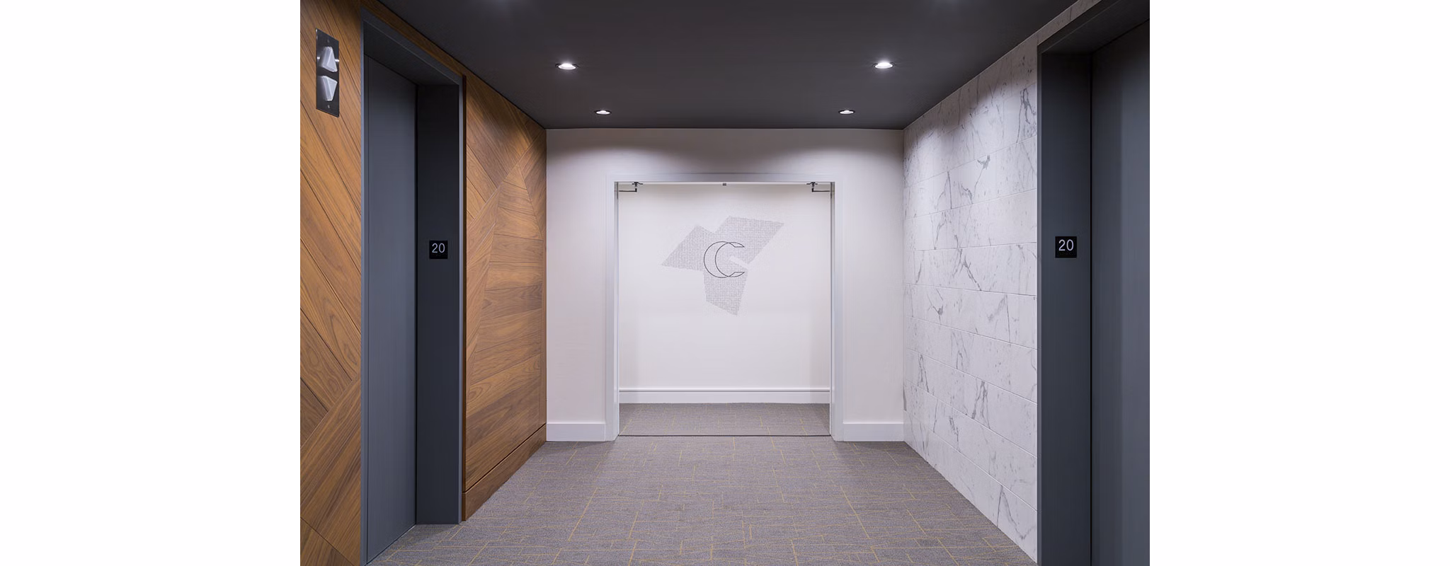 Hallway with modern elevator doors at Circa LA Apartments in luxury Greystar community