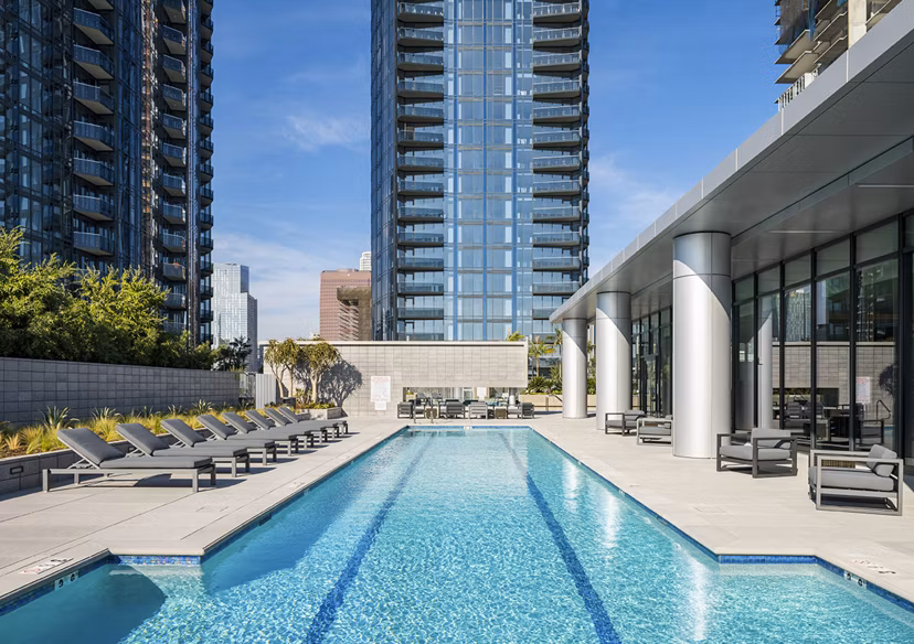 Resort-style pool with lounge chairs at Circa LA Apartments, offering luxury living