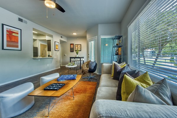Modern living room showcasing cozy seating and stylish decor at Galleria Palms Apartments