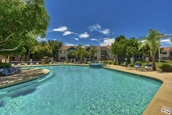 Galleria Palms Apartments: Elegant pool area surrounded by palm trees