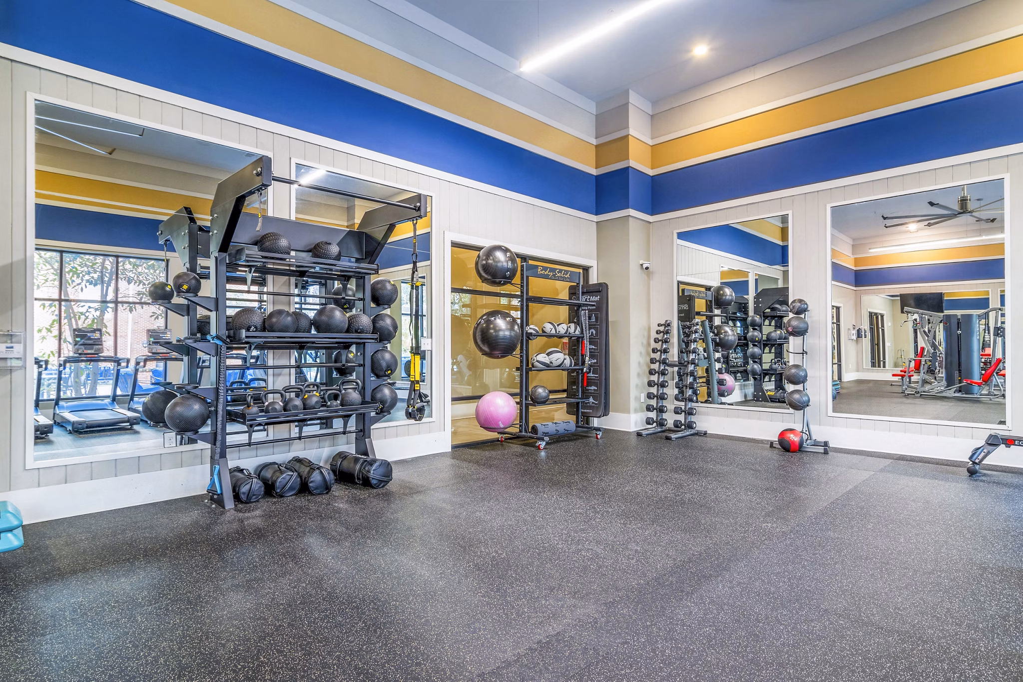 Modern fitness center with state-of-the-art equipment at The Standard Apartments, perfect for maintaining an active lifestyle