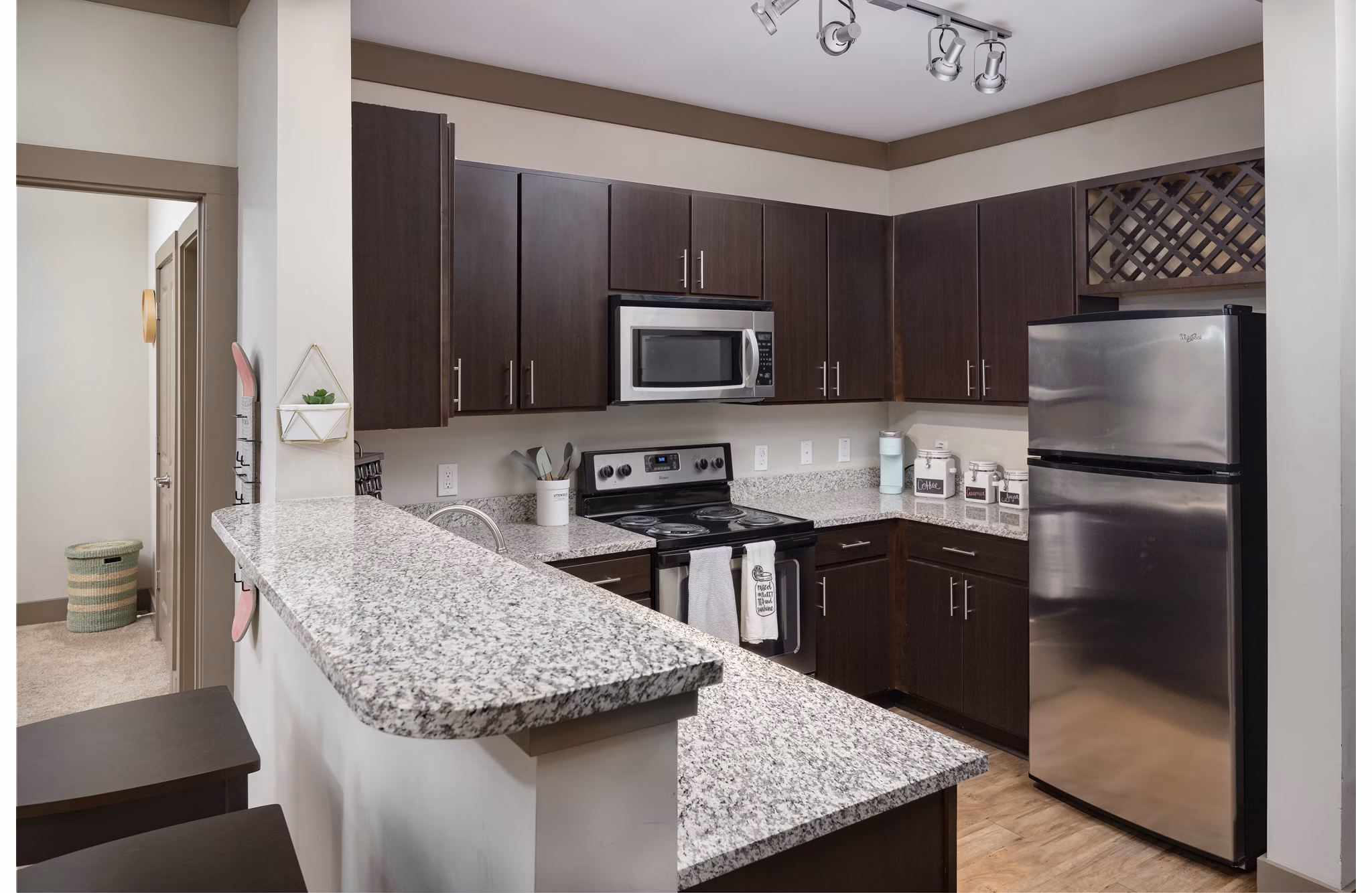 Modern kitchen with stainless steel appliances at The Standard at Athens Apartments