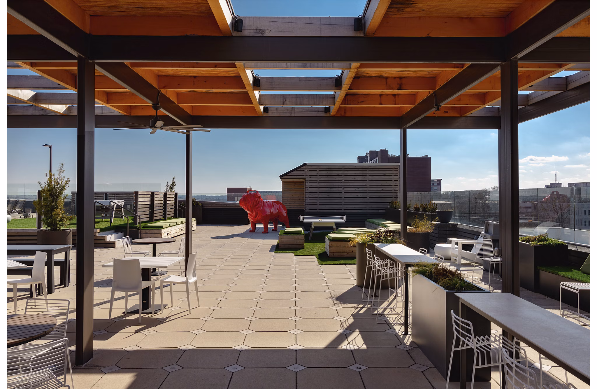 Inviting courtyard with lush greenery and seating areas at The Standard at Athens Apartments