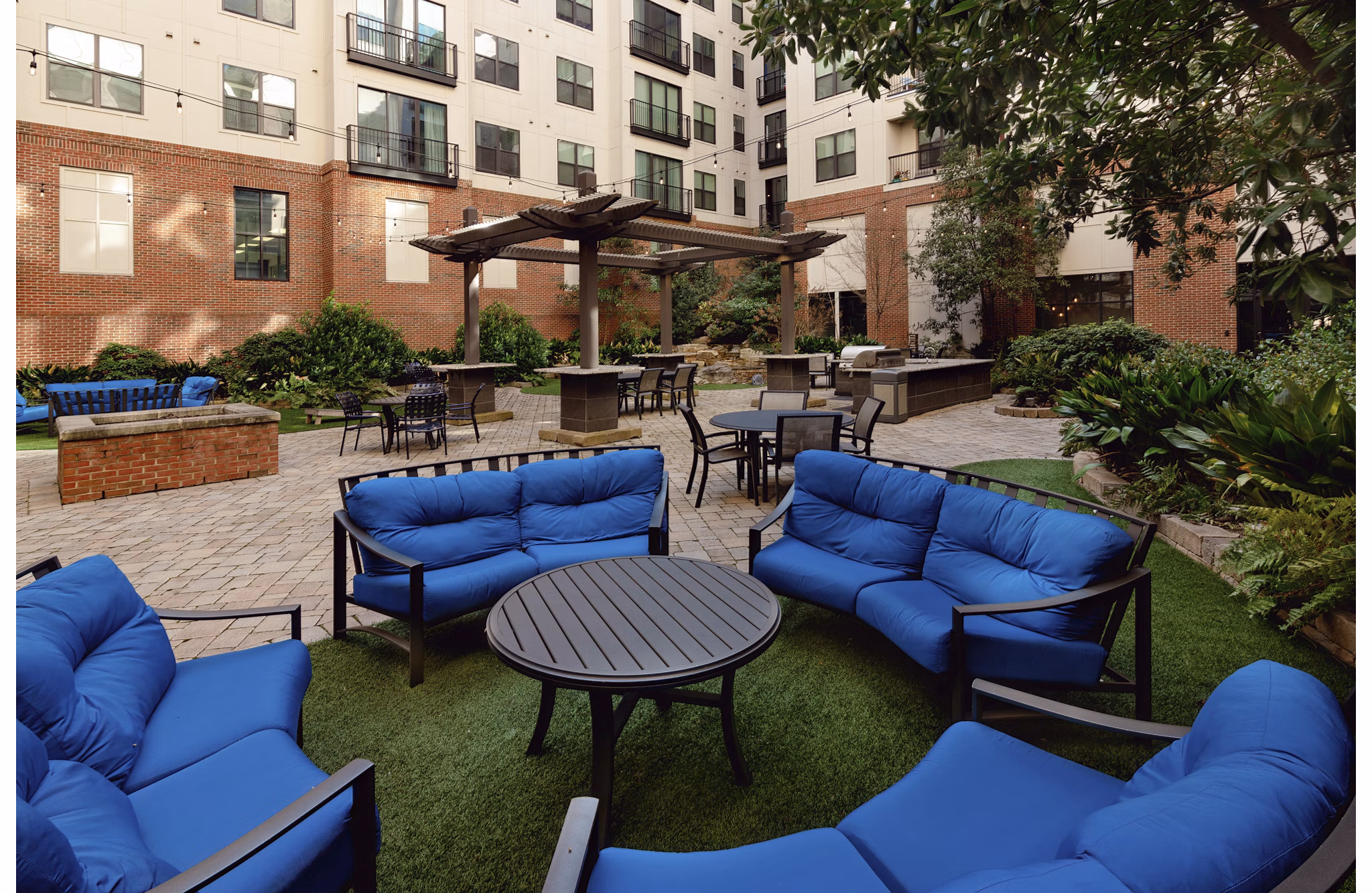 The Standard at Athens: Serene courtyard with lush greenery and seating areas