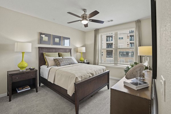 Cozy bedroom with modern decor at 2785 Speer Apartments offering luxury living in a desirable location