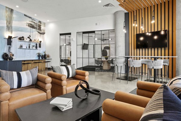 Clubhouse featuring modern design and cozy seating at 2785 Speer Apartments