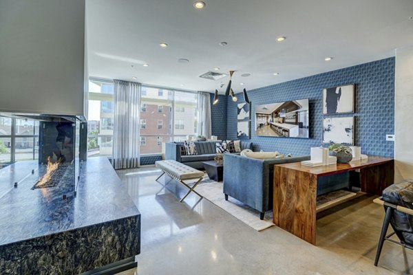 Modern clubhouse featuring stylish seating and art-filled walls at 2785 Speer Apartments