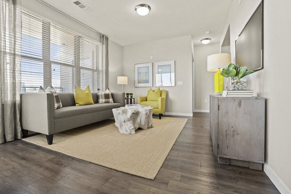 Spacious living room with modern decor at 2785 Speer Apartments in Greystar's luxury community