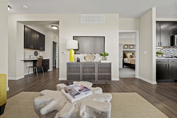 Modern living room with stylish furnishings at 2785 Speer Apartments, luxury Greystar property in desirable location