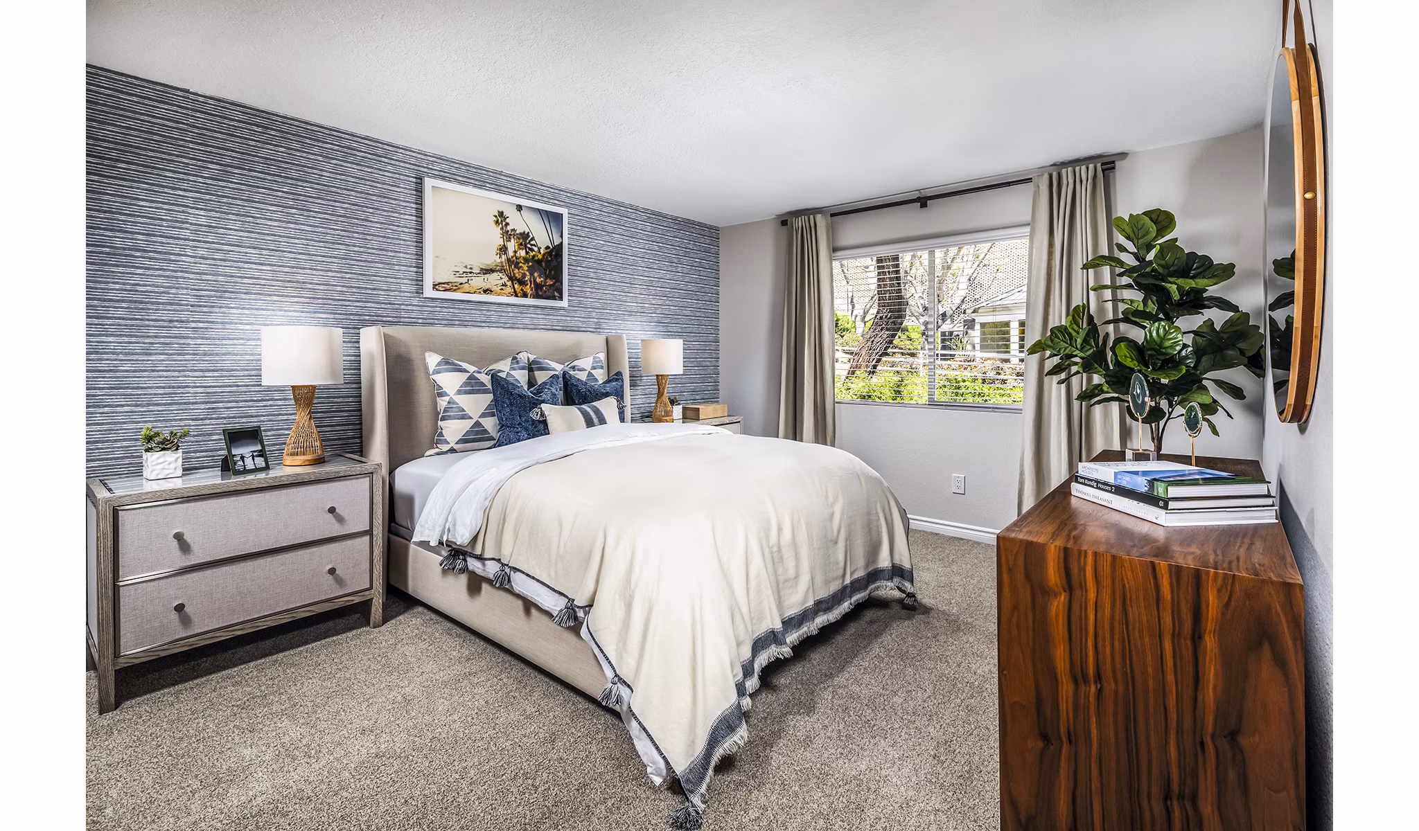 Inviting bedroom with contemporary decor in Artisan Laguna Beach Apartments: luxury coastal living