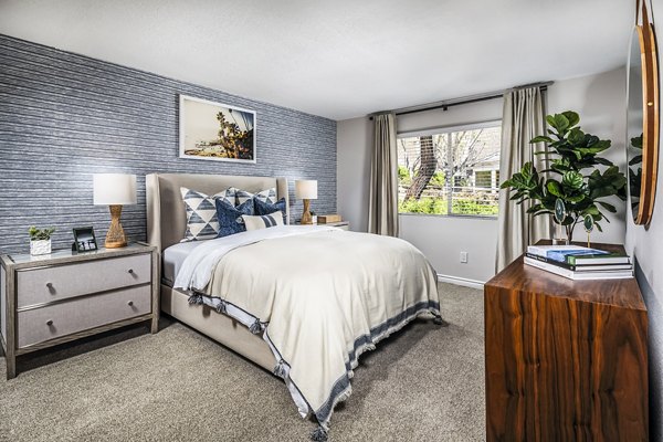 Inviting bedroom with contemporary decor in Artisan Laguna Beach Apartments: luxury coastal living