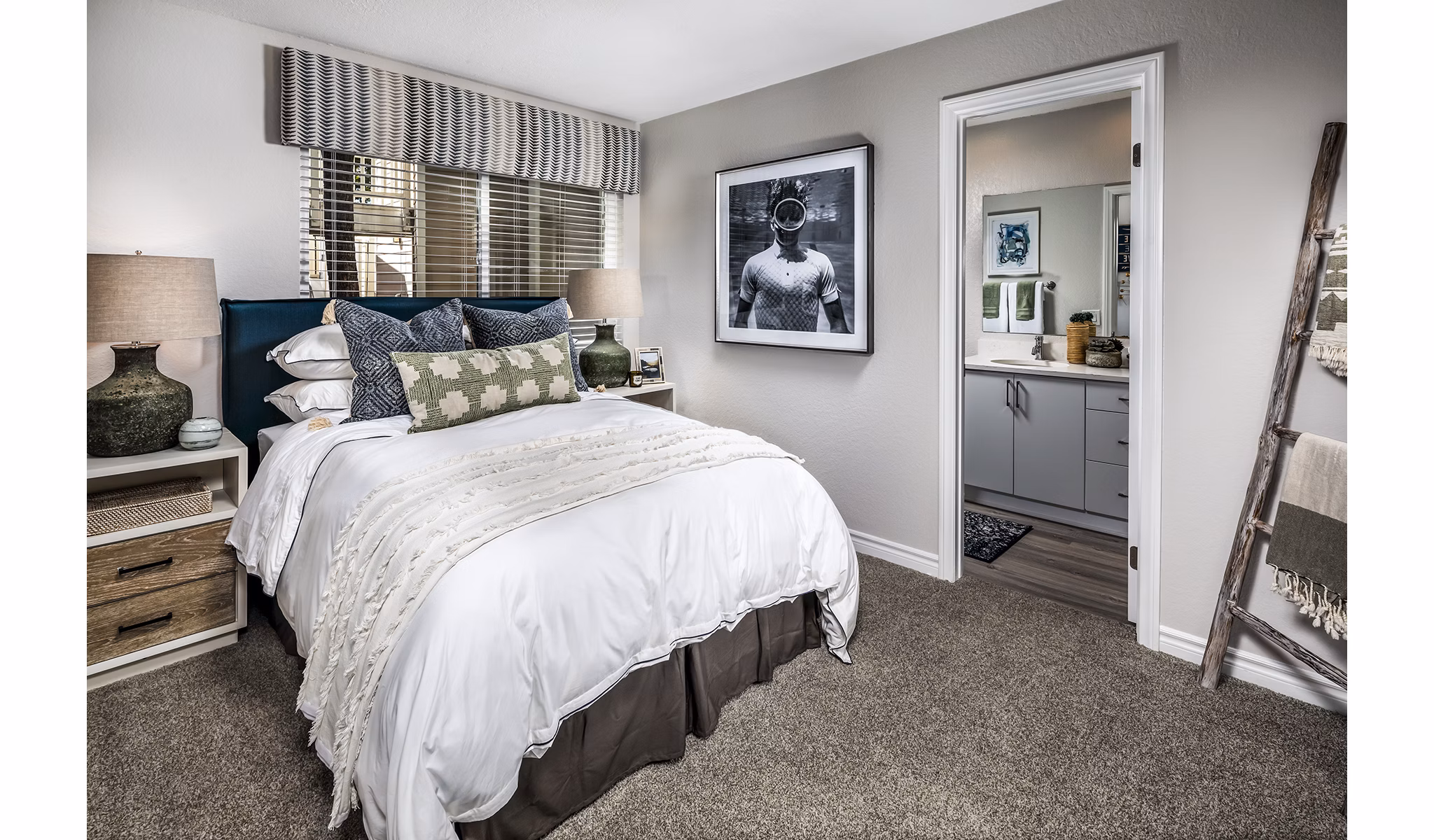 Cozy bedroom with ocean-inspired decor in Artisan Laguna Beach Apartments