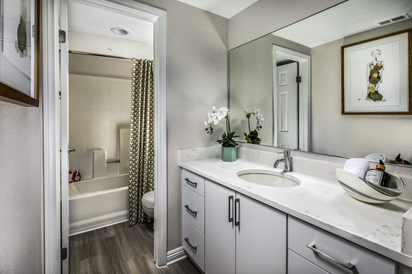 Artisan Laguna Beach: Elegant bathroom with sleek fixtures and modern design in luxury apartments
