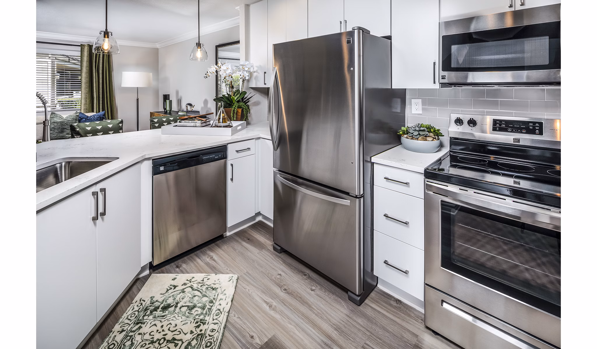 Modern kitchen with stainless steel appliances at Artisan Laguna Beach Apartments