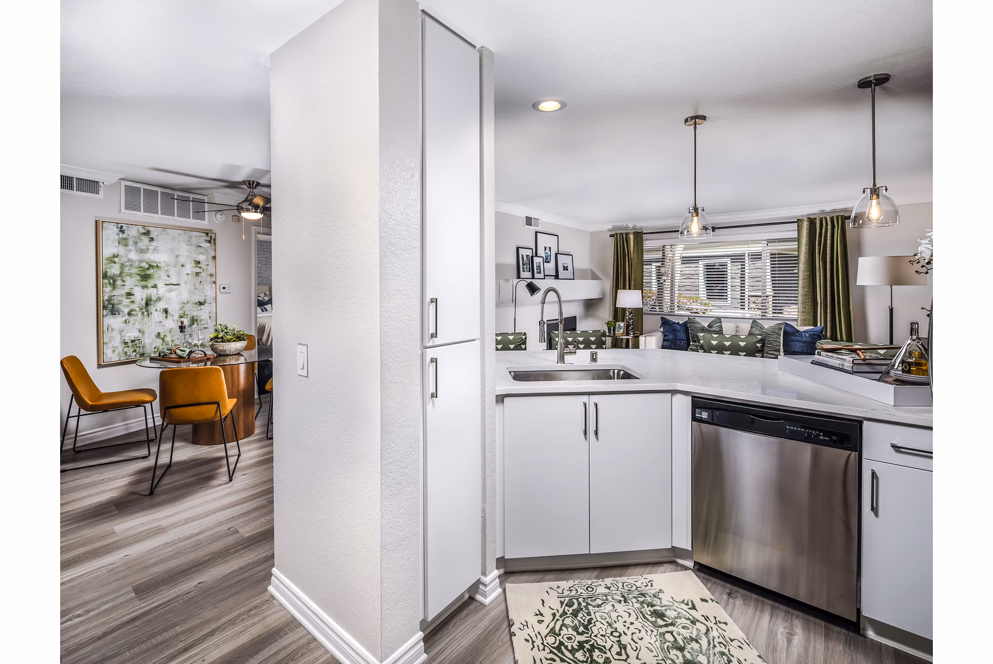 Kitchen featuring modern appliances and sleek countertops at Artisan Laguna Beach Apartments