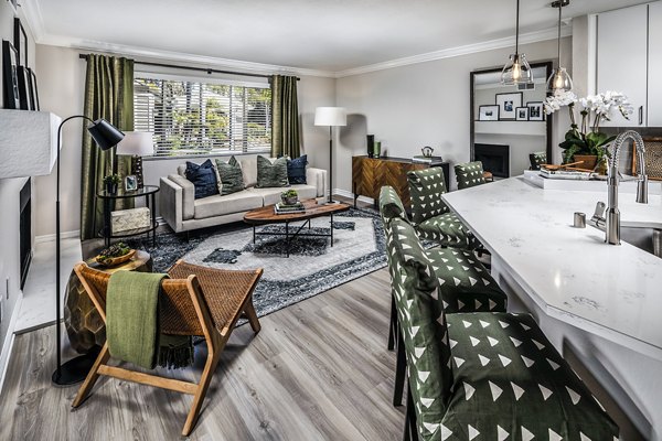 Dining room and living room with coastal design at Artisan Laguna Beach Apartments, featuring open layout and elegant decor