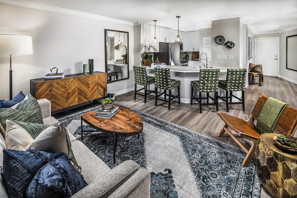 Modern living room with stylish decor at Artisan Laguna Beach Apartments, featuring ocean views and spacious seating area