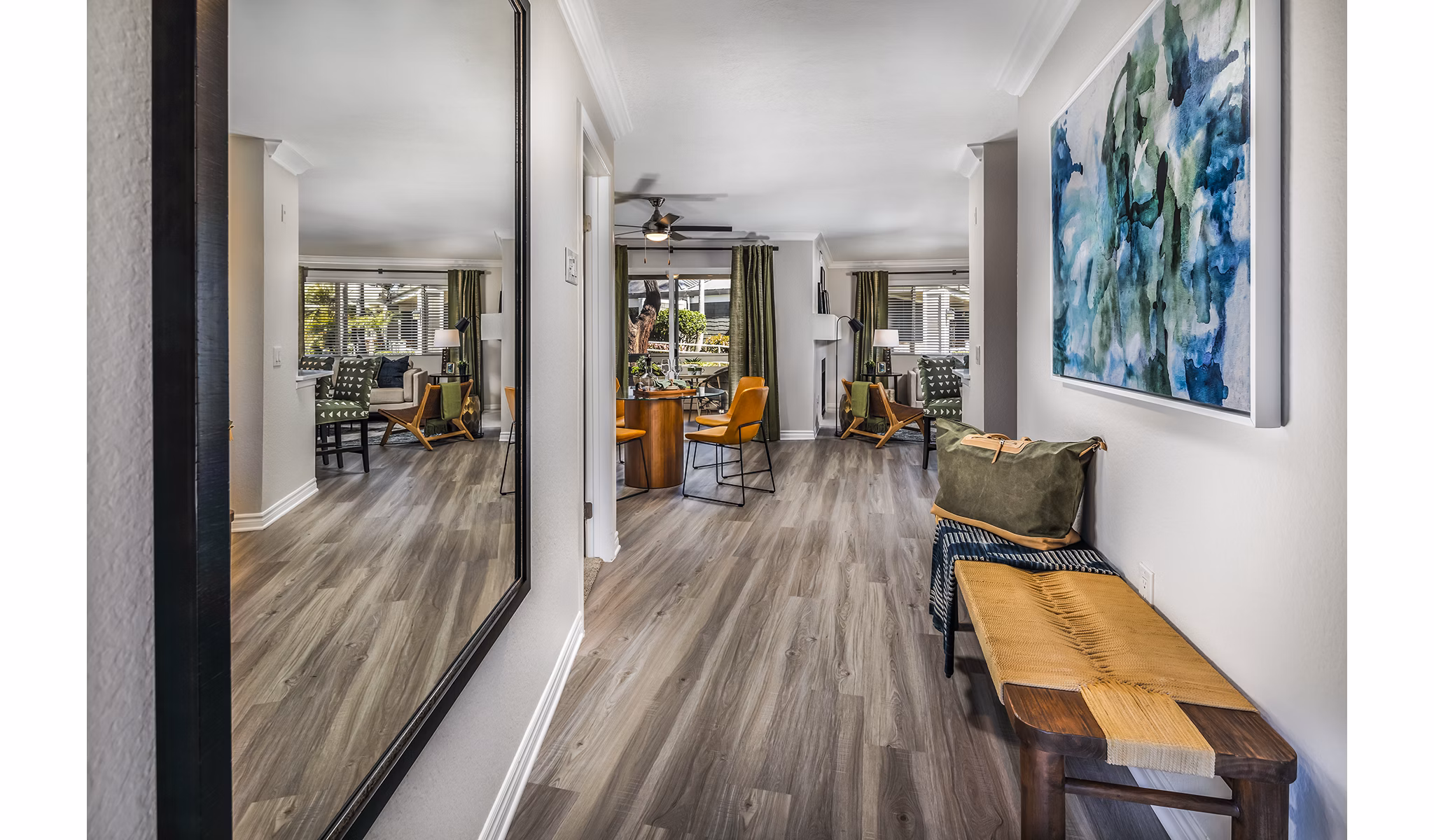 Welcoming hallway entrance with modern decor at Artisan Laguna Beach Apartments, offering luxury living in a prime coastal location