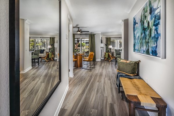 Welcoming hallway entrance with modern decor at Artisan Laguna Beach Apartments, offering luxury living in a prime coastal location