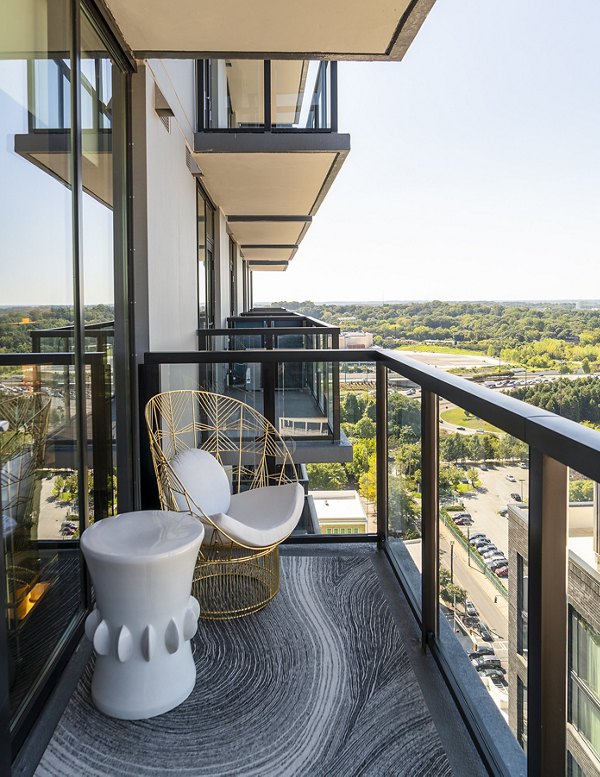 Ascent Midtown Apartments: Cozy patio balcony with modern seating for relaxing in the heart of the city