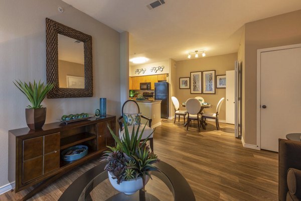 Cozy living room featuring modern furnishings and a large window in Mandalay at Shadow Lake Apartments