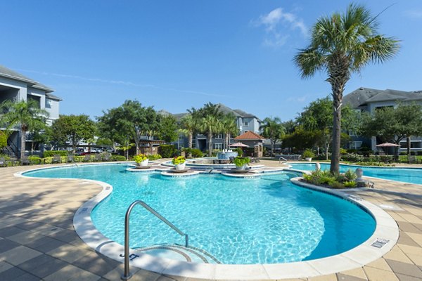 Inviting outdoor pool at Mandalay at Shadow Lake Apartments offering luxury relaxation in the sun