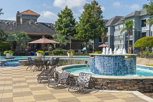 Relaxing poolside with sun loungers at Mandalay at Shadow Lake Apartments